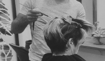 Hairdresser, Richard, colouring a client's hair